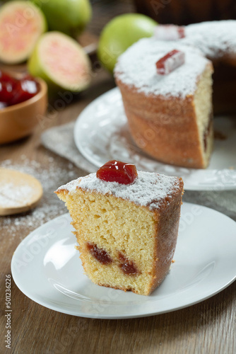 Wallpaper Mural Close up piece of Brazilian corn cake made with a type of corn flour (Fuba) filled with guava paste. On a wooden party table. Typical sweets of the June festival. Cornmeal cake Torontodigital.ca