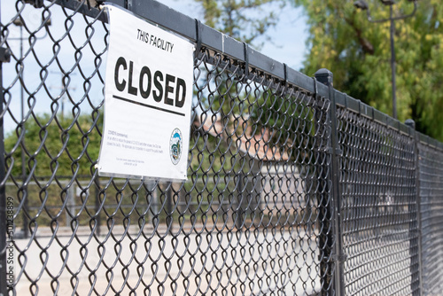 Closed sign at skatepark fence during Covid