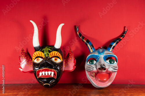 Máscaras típicas de Cuzco - Perú con fondo rojo photo