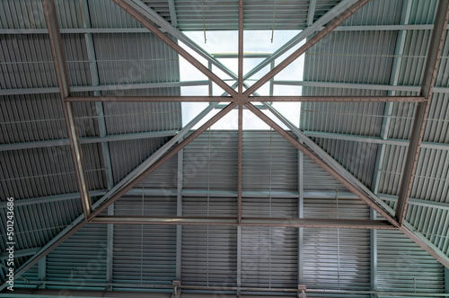 Metal Roof in an Industrial Building with a Glass Sunlight.