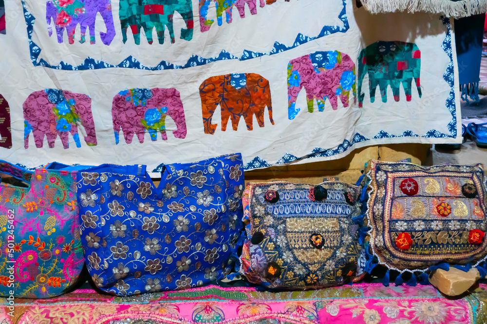 Beautiful colorful Indian sarees are displayed for sale at market place, Jaisalmer, India.