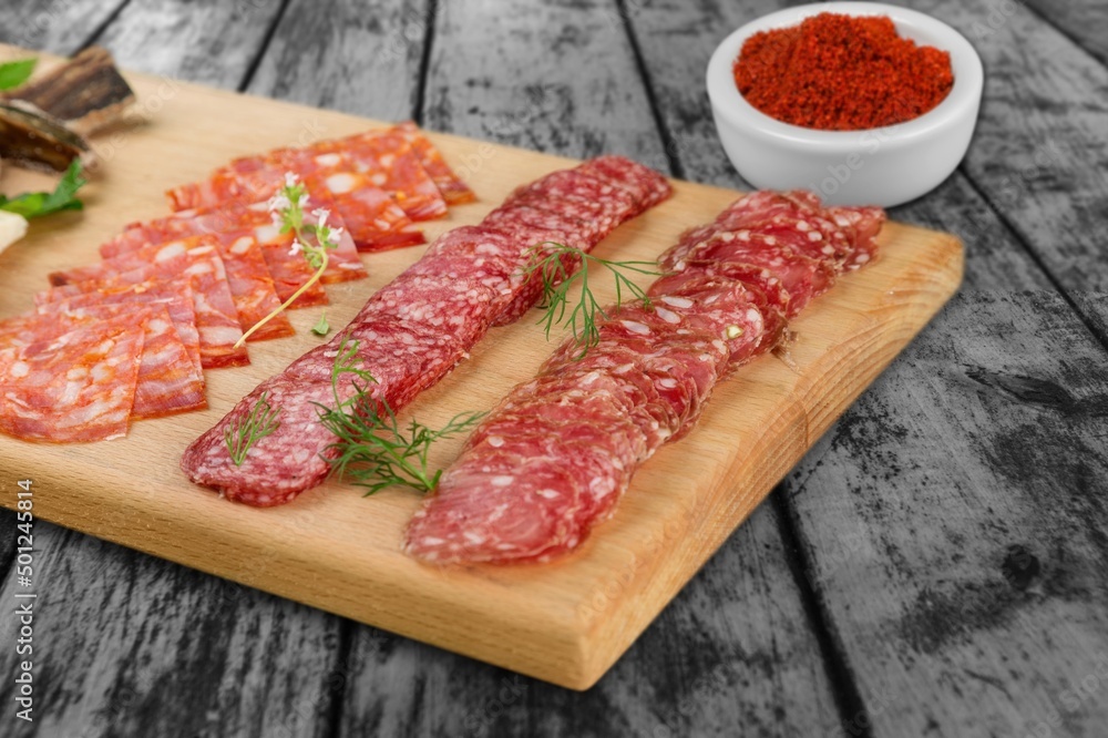 Traditional raw meat ham on wooden board. Traditional raw meat ham on wooden board.