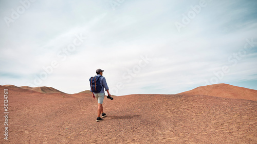 asian man backpacker photographer looking at view outdoors