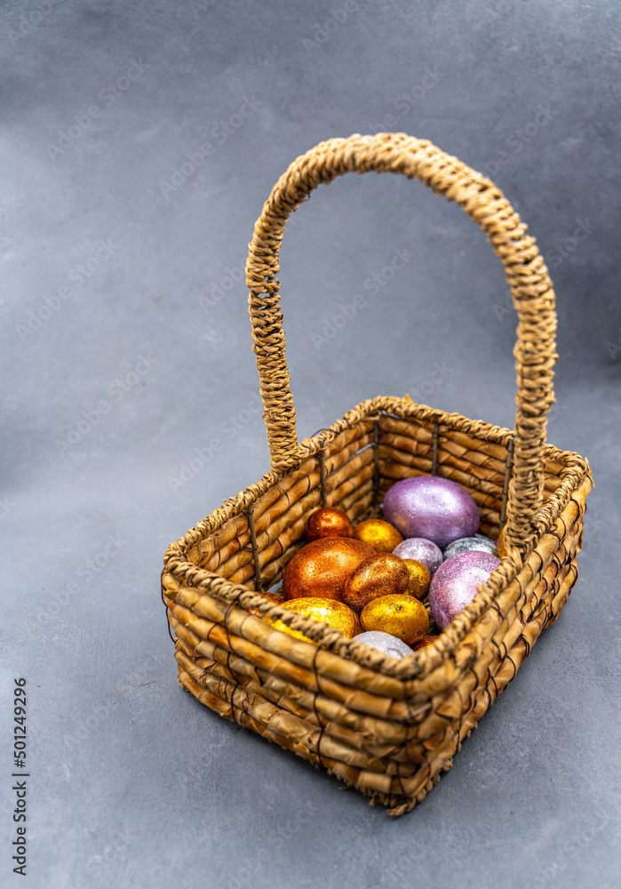 Easter background with golden and colored eggs. Happy easter background top view