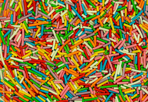 Dots of sugar sprinkles, cake and pastry decoration, lots of sprinkles as a background