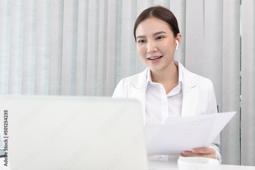 Young Asian women are talking friends and manager through video chats and greeting them with cheerful expressions, Online communication , Stay home, New normal, VDO Call, Internet working. Young Asian women are talking friends and manager through video chats and greeting them with cheerful expressions, Online communication , Stay home, New normal, VDO Call, Internet working.
