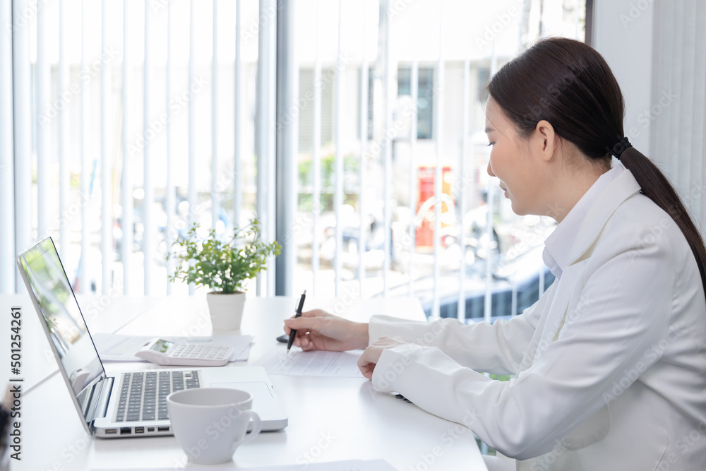 Financial businesswoman analyze the graph of the company's performance to create profits and growth, Market research reports and income statistics, Financial and Accounting concept. Financial businesswoman analyze the graph of the company's performance to create profits and growth, Market research reports and income statistics, Financial and Accounting concept.