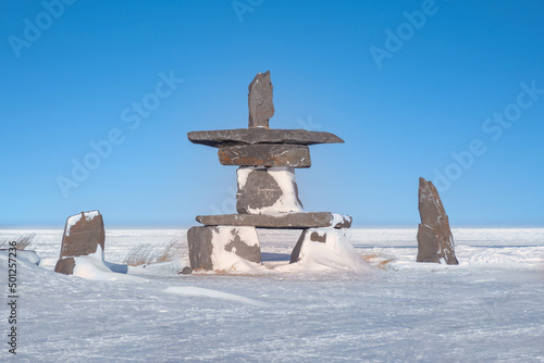 An Arctic cultural landmark known as an Inukshuk, used as navigational aids and communication by First Nations people in the Canadian north. Churchill, Manitoba.