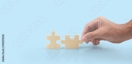 Connecting jigsaw puzzle in hand