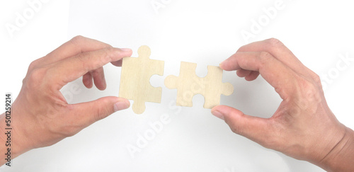 Connecting jigsaw puzzle in hand