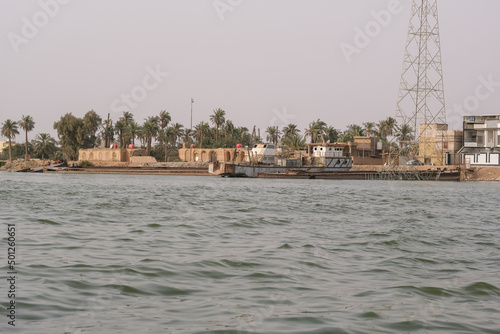 Basra, Iraq - April 15, 2022: landscape photo of the tour in river in basra city photo