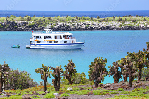 Typical tourist yacht anchored between South Plaza and North Plaza islands, Galapagos National Park, Ecuador. photo