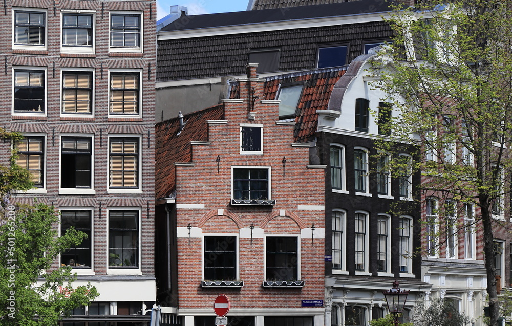 Naklejka premium Amsterdam Noordermarkt Square Brick House Facade with Stepped Gable Close Up, Netherlands