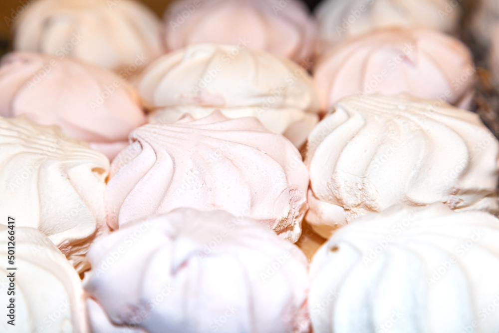 Several white and pink marshmallows, close-up. Several white and pink marshmallows, close-up.