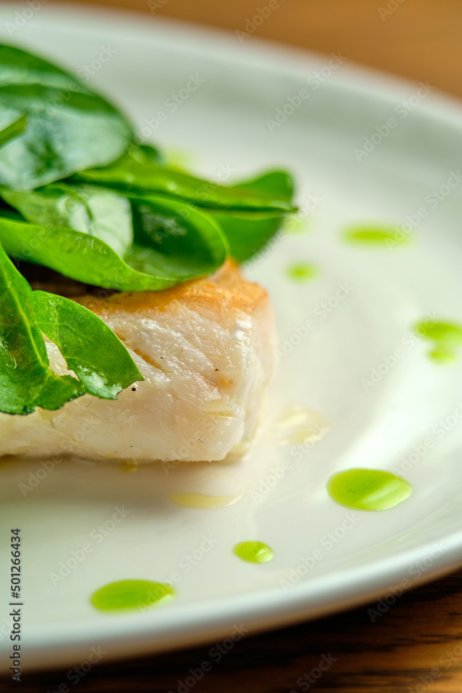 Pike perch fish fillet with spinach leaves Pike perch fish fillet with spinach leaves