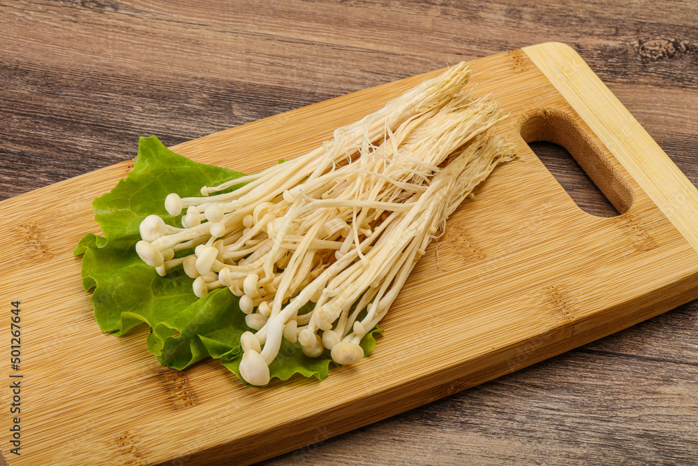 Raw Enoki mushrooms for cooking