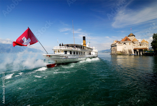 Photo Steamboat passing Chillon castle occupied since Bronze Age, located near Veytaux