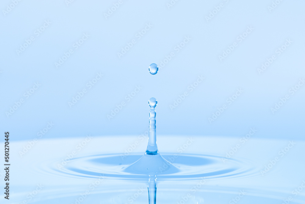 Drop hitting surface of water close-up Drop hitting surface of water close-up