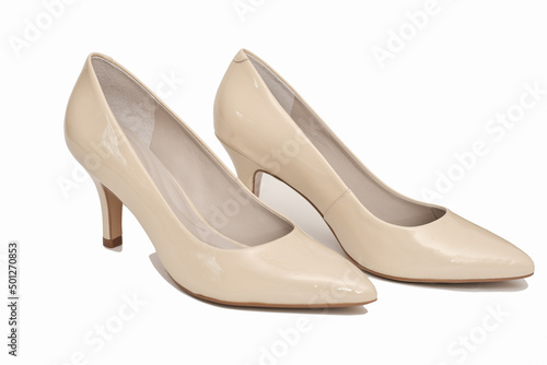 elegant leather beige shoes isolated on white background. fashion, retail or blogger content. high heel everyday comfortable shoes