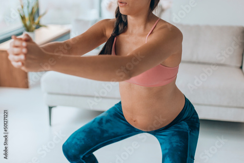 Slika na platnu Pregnancy workout woman doing squat glutes exercises at home