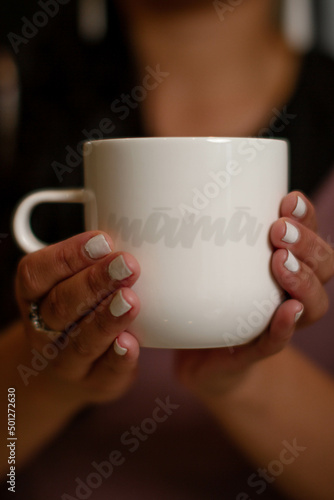 woman holding cup of tea