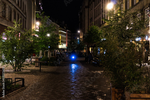 Biker driving at night through streets