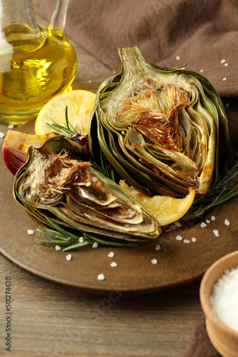 Concept of tasty food with grilled artichoke, close up