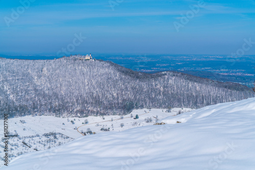 Germany, Castle teck on mountain teckberg covered by snow in winter wonderland nature landscape scene panorama view on sunny day on swabian alb