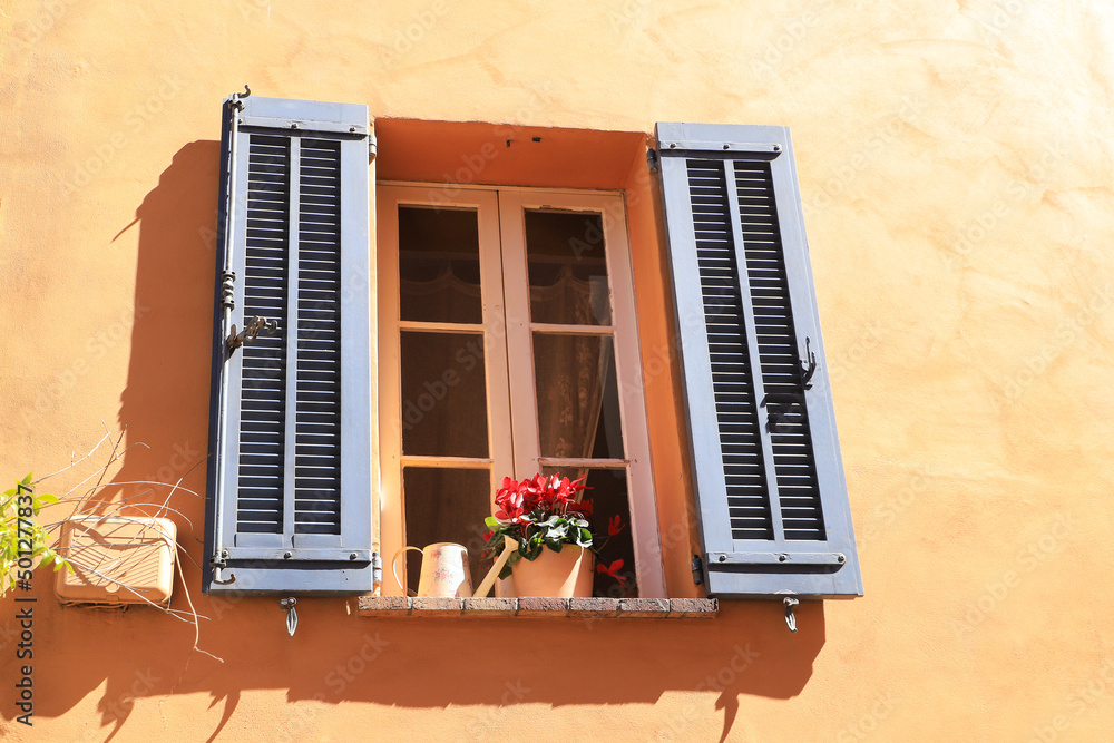 A close up window in the medieval village Mouans-Sartoux near french riviera - France