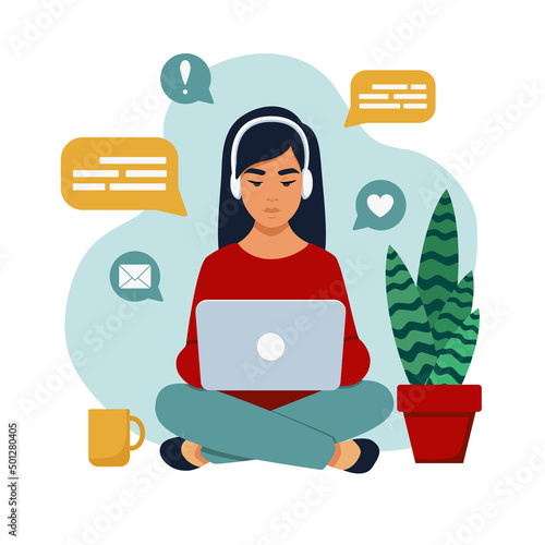 A girl with a laptop on her lap