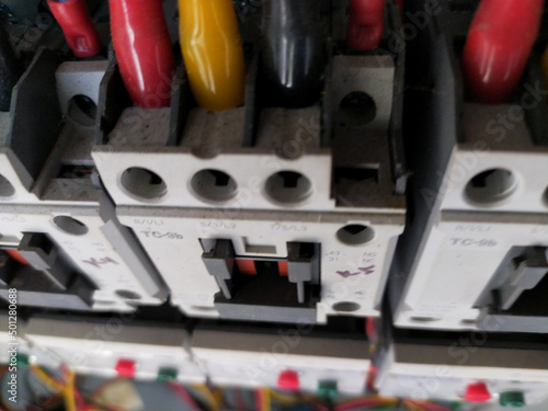 Close-up electrical wiring main contactors of machine control. 