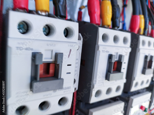 Close-up electrical wiring main contactors of machine control.
 photo