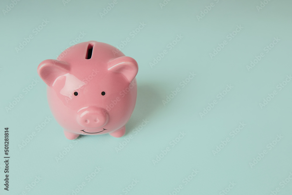 Piggy bank on a blue background with copy space Piggy bank on a blue background with copy space