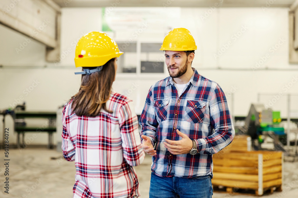 An industry worker reporting about production in facility. An industry worker reporting about production in facility.