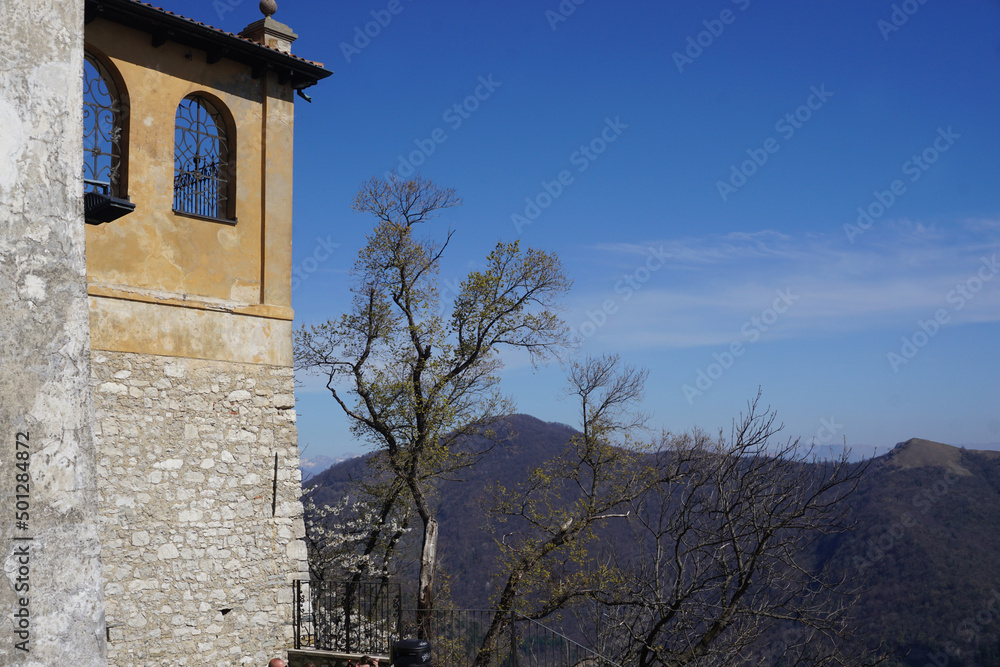old stone corner veranda with a view on the surrounding hills in Ticino