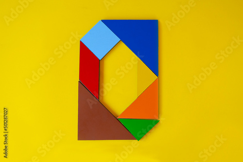 Colorful number 0 made with tangram toy, colored tangram number zero isolated on yellow background, kids game idea, teaching counting for children, puzzle toy, top view of null numeric Free Download Colorful number 0 made with tangram toy, colored tangram number zero isolated on yellow background, kids game idea, teaching counting for children, puzzle toy, top view of null numeric - GFXLoad