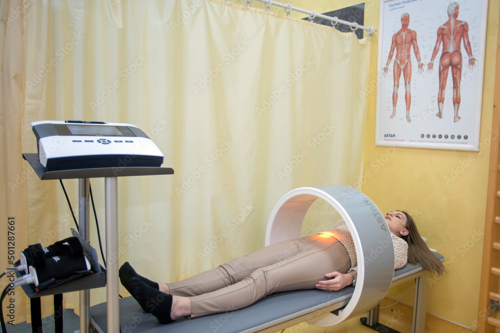 therapy system. Patient on a treatment bed with Field