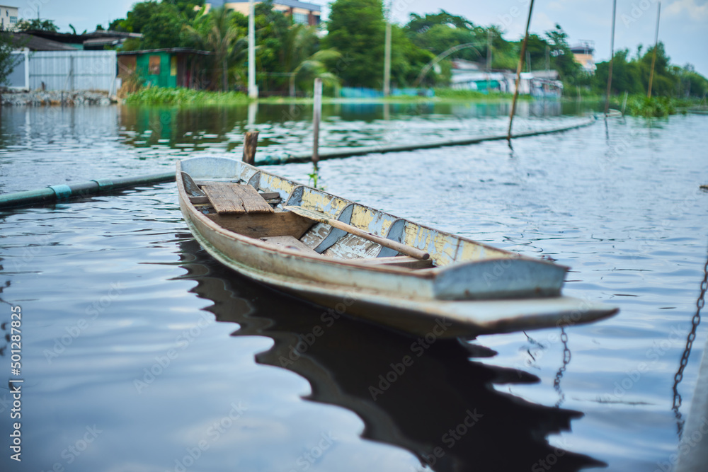 Thai rowing boat floating in Prawet Buri Rom canal
