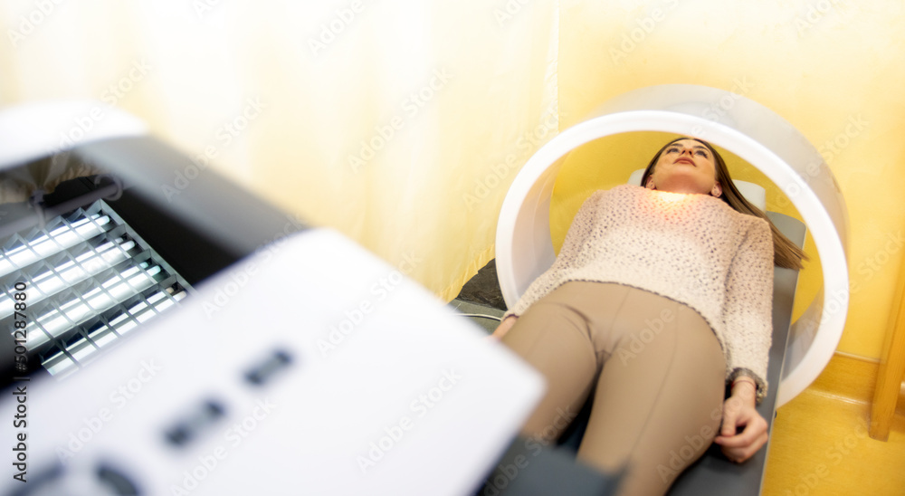 therapy system. Patient on a treatment bed with Field