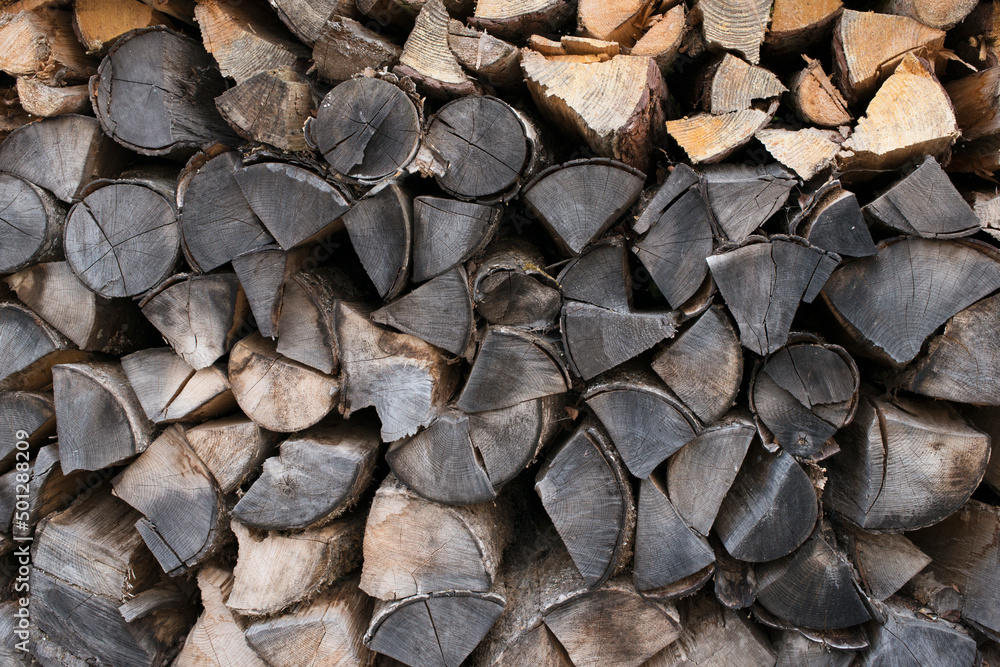 Fresh brown pile of tree stumps, woods structure. Wooden pattern background. Ecological heating, renewable energy sources. Ecological fuel. Sawmill, woodworking industry
chopped firewood