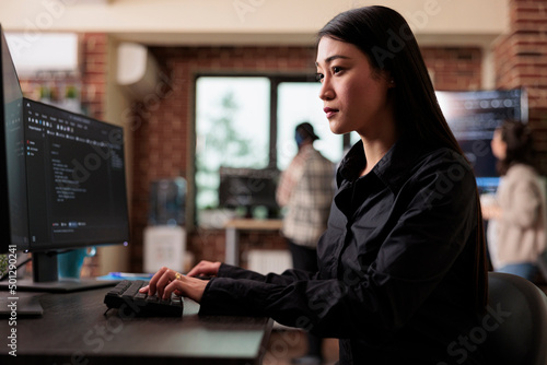 Photography Cyber officer encrypting big chunks of data in order to secure important files