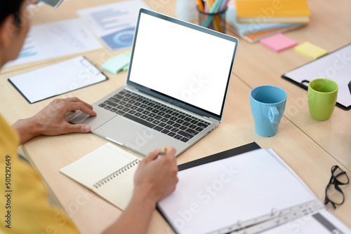 Close-up image, Businessman working at his desk, using laptop