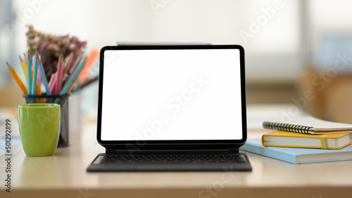 Close-up image, Study table or teens workspace with portable tablet