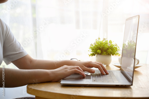 Female working, using or typing on laptop computer © bongkarn