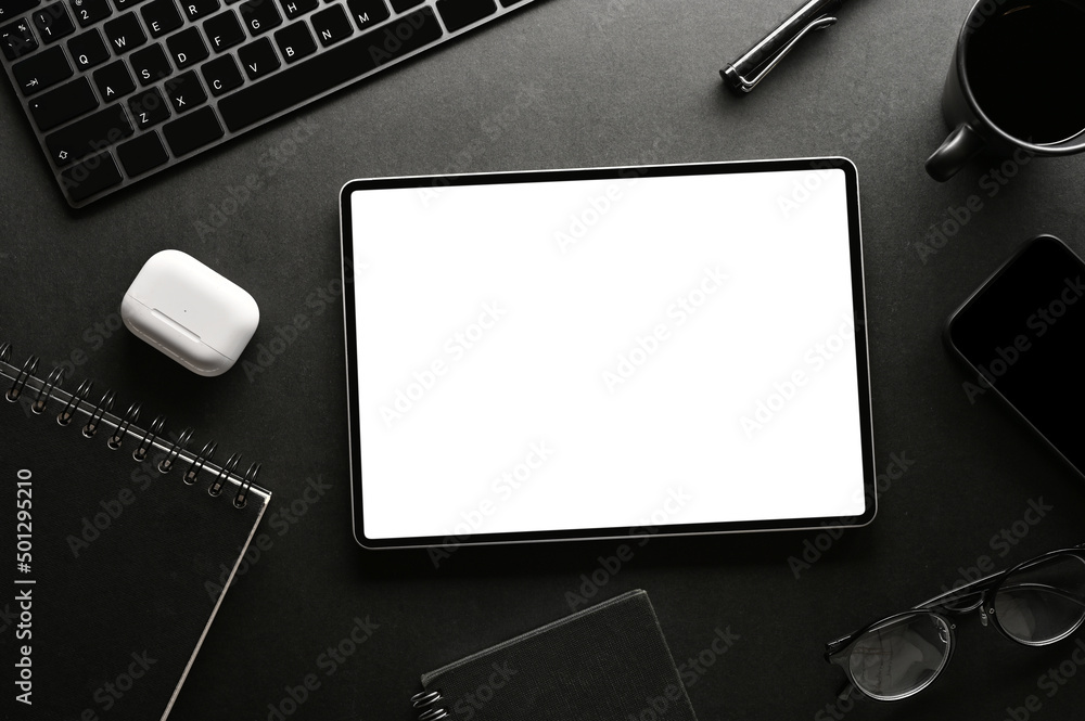 Modern black office desk background with office accessories and digital  tablet mockup. Stock-Foto | Adobe Stock