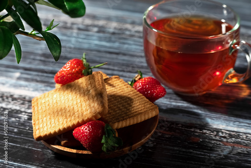 tea with strawberry and coocies photo