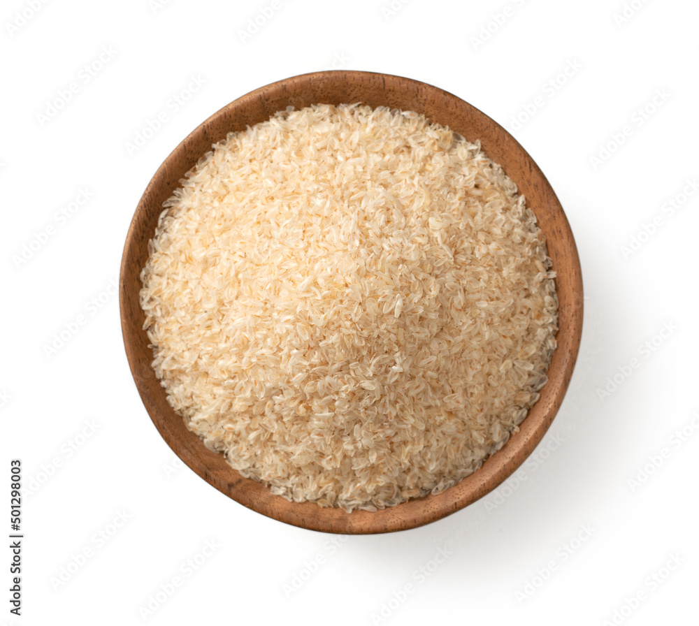 Psyllium husks in the wooden bowl, isolated on white background, top view. Psyllium husks in the wooden bowl, isolated on white background, top view.