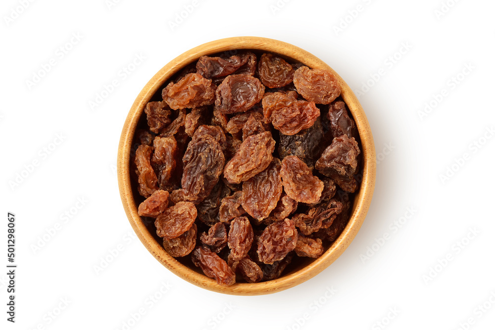Raisins in wooden bowl on white background