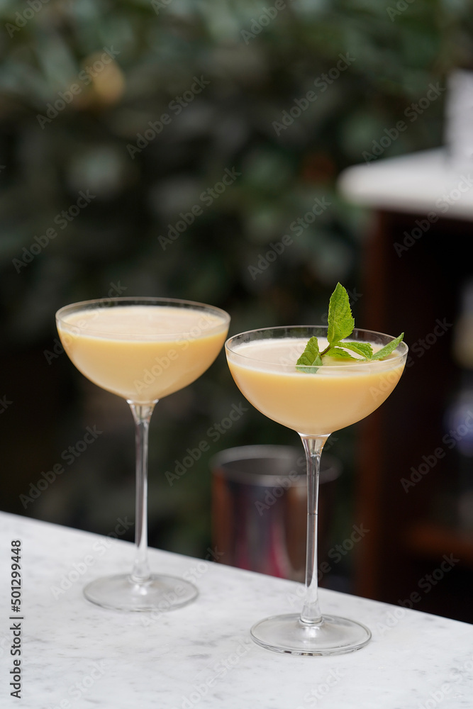 Cocktail glass with Baileys Irish cream, passion fruit,