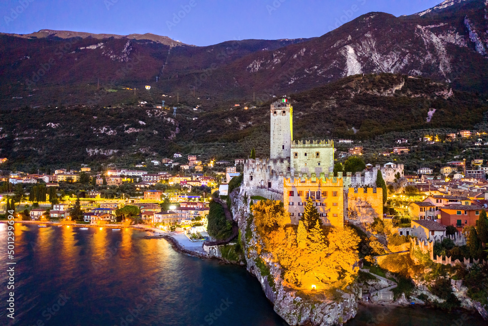 Aerial night view of Scaliger Castle in Malcesine - Lake Garda, Northern Italy